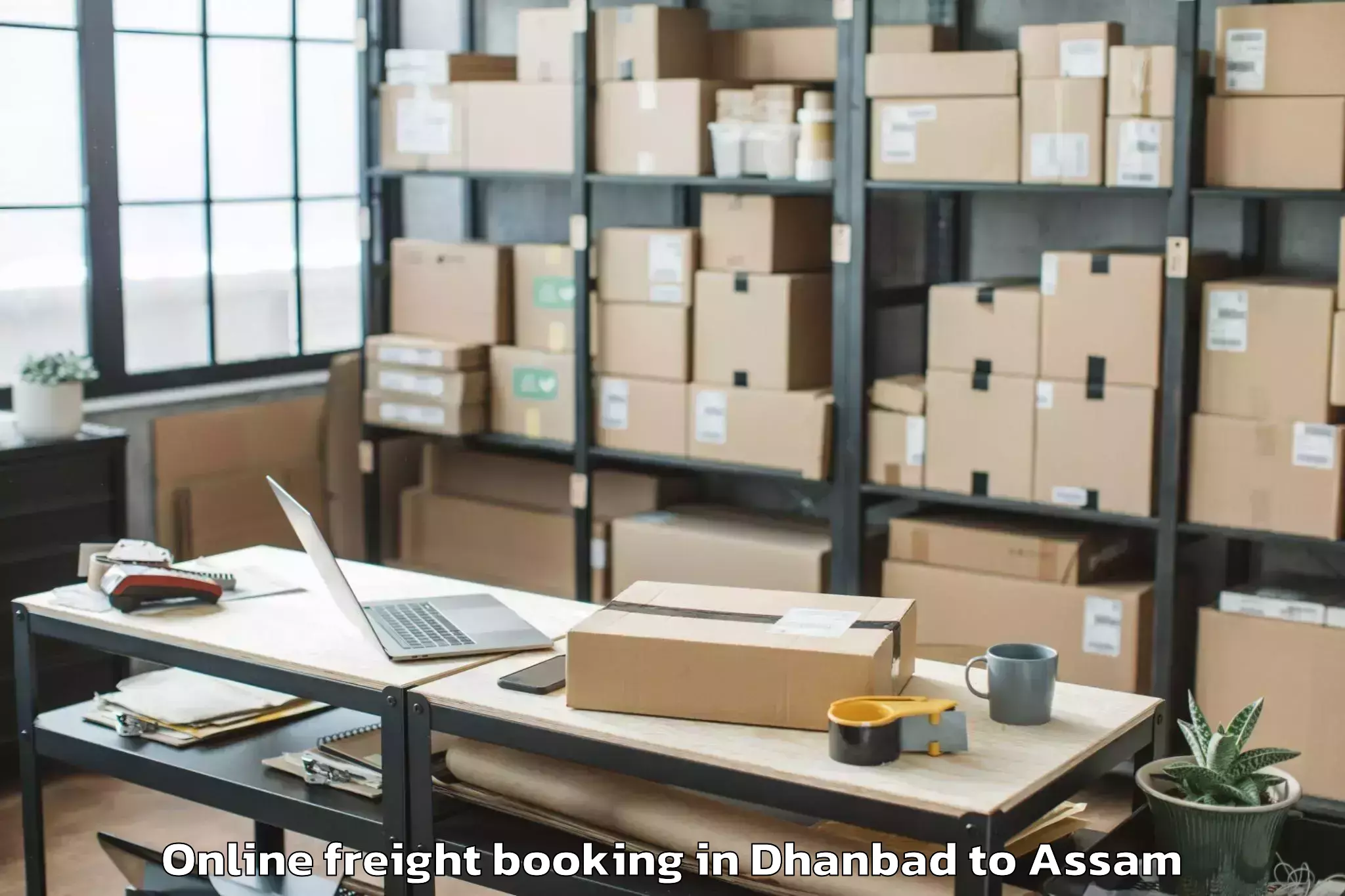 Top Dhanbad to Raha Gaon Online Freight Booking Available